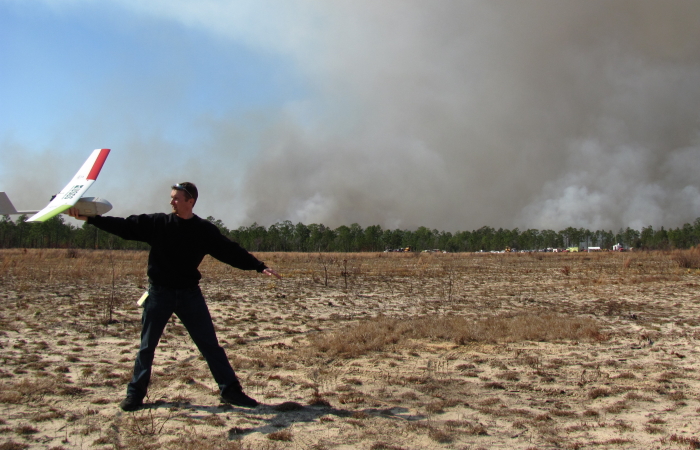 Mark Bauer, NUSO, preparing to hand launch the Raven at the prescribed burn