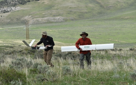 NUPO researchers Todd Burton and Joe Adams retrieving the Falcon Fixed Wing